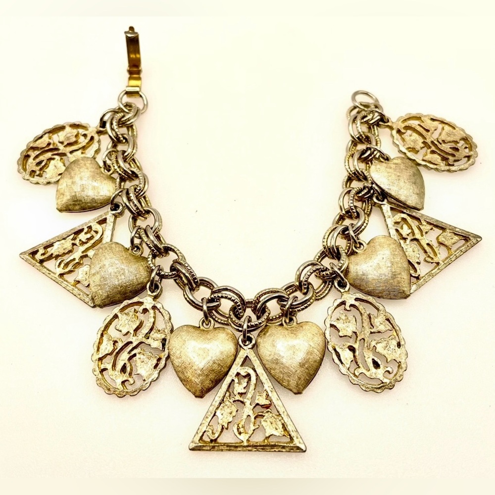 Vintage Silver Tone Charm Bracelet. Hearts and Openwork Floral Design Charms